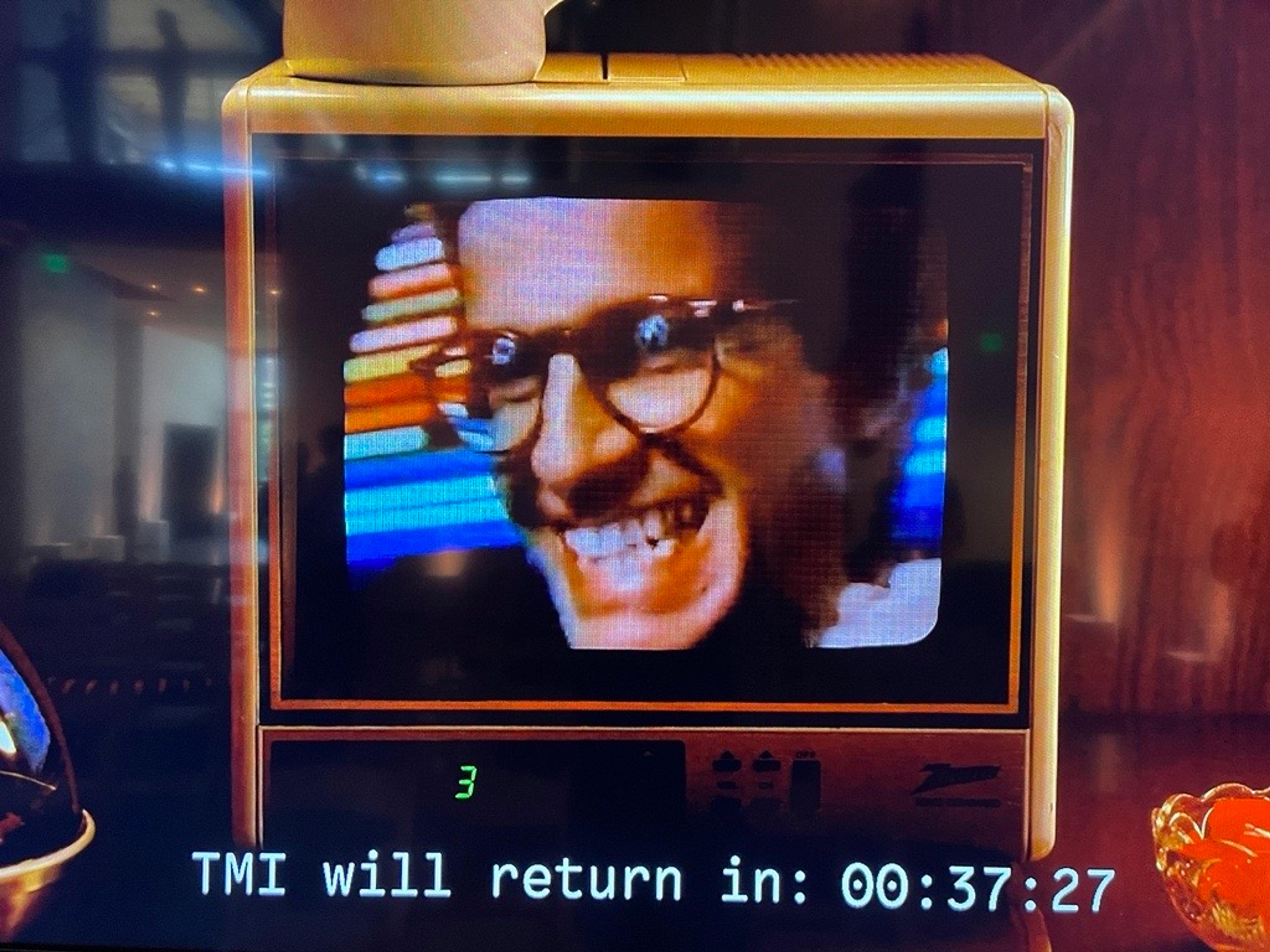 Retro television with the caption, "TMI will return in: 00:37:27".