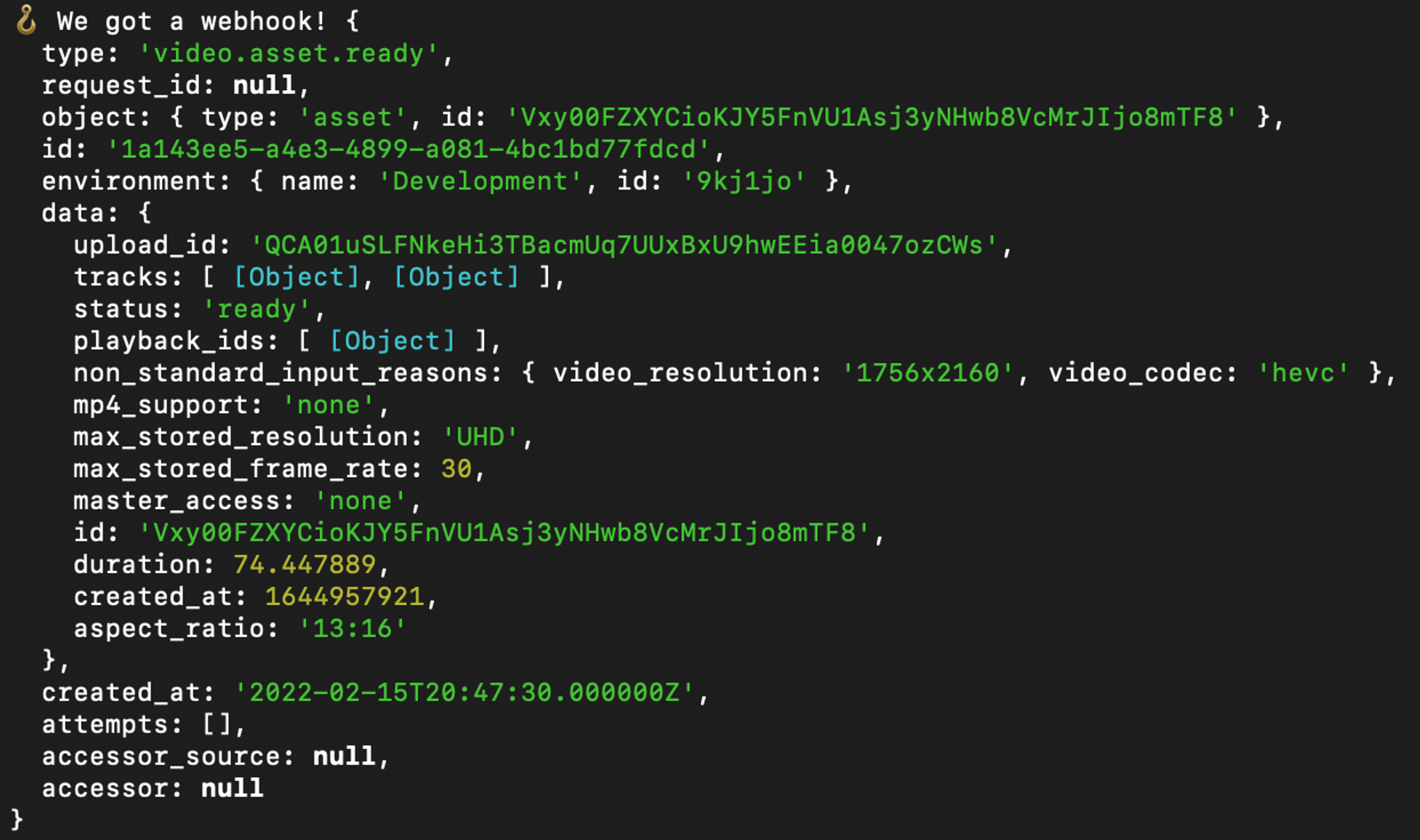 A JSON object in the terminal representing a webhook with type: video.asset.ready.