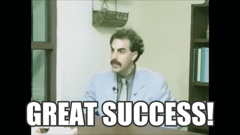 An animated GIF of Sacha Baron Cohen playing the character Borat. He is pumping his fists with excitement. The image is captioned, "Great success!"