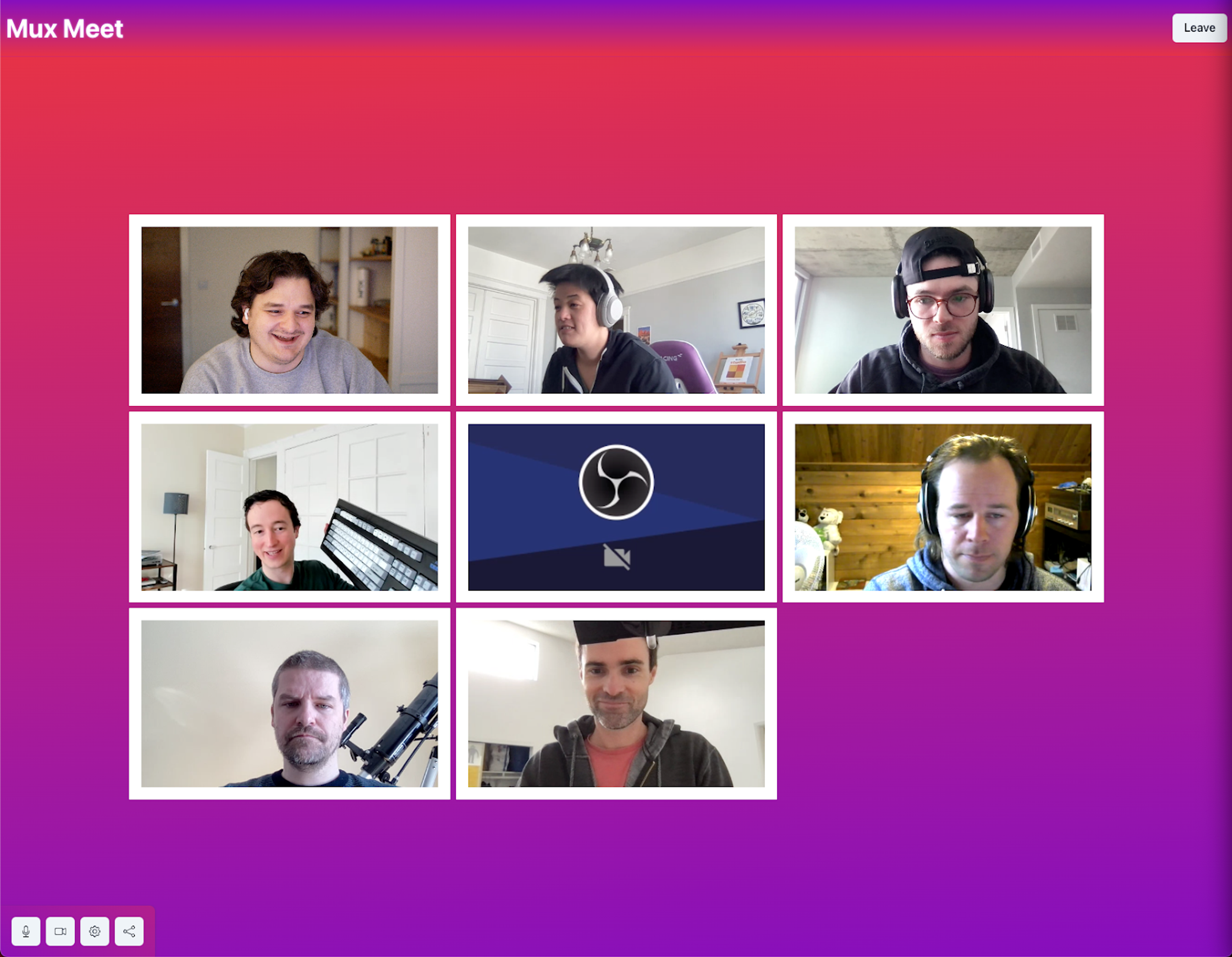 A screenshot of an early version of Mux Meet before a designer stepped in. It's bright pink. There are 8 participants on a video conferencing call. 