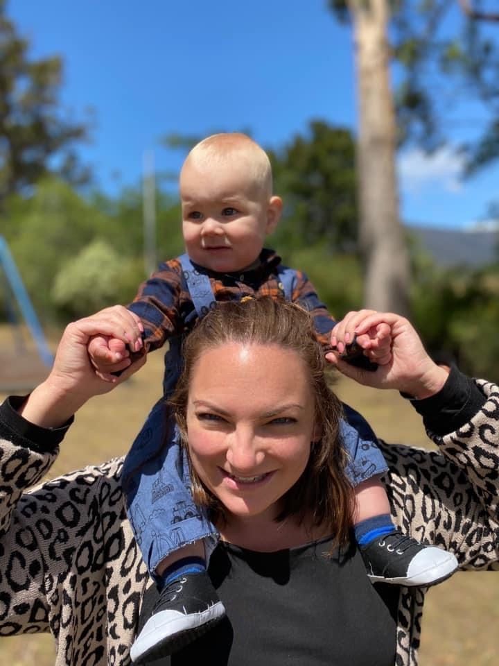 Mother and baby on her shoulders