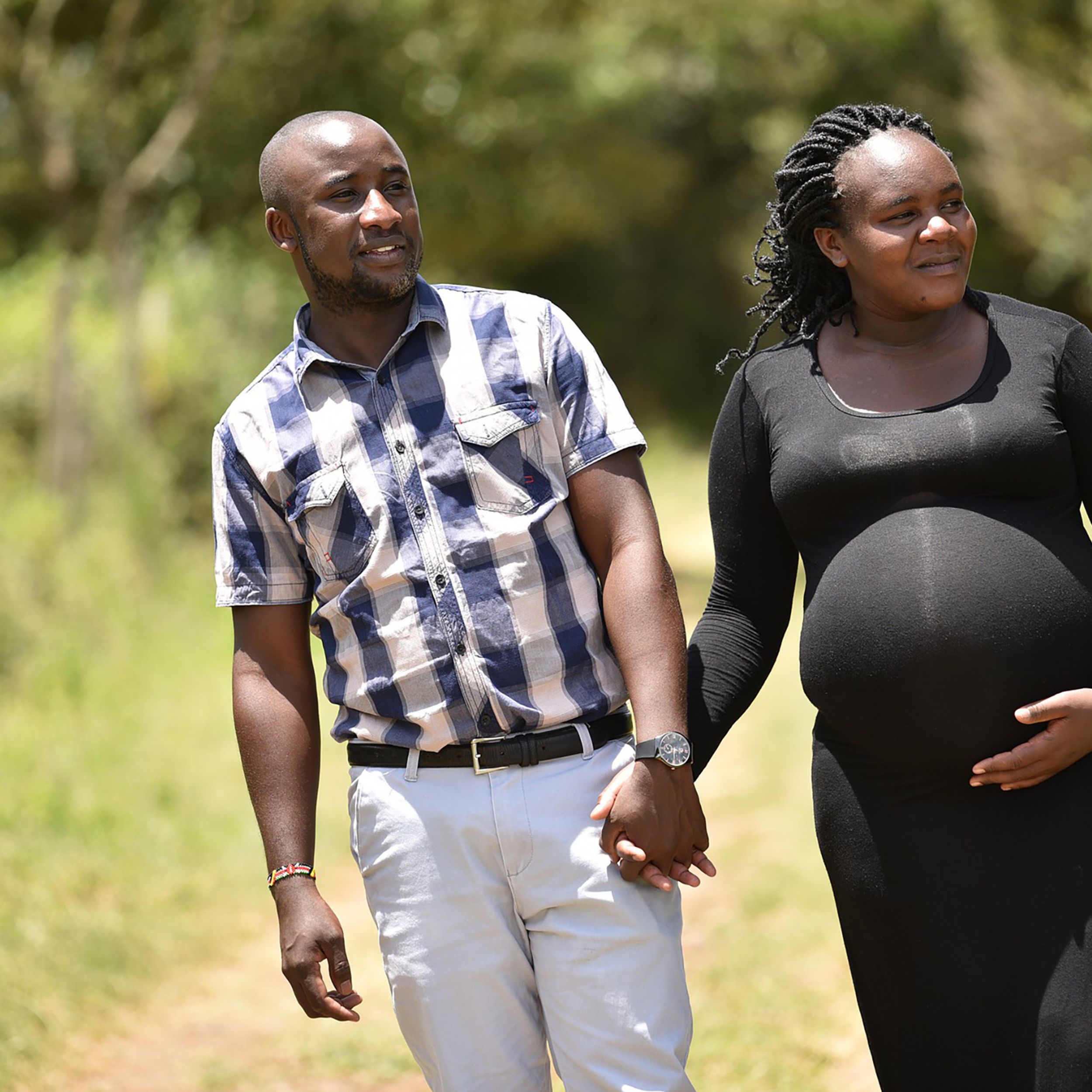 Pregnant mum and dad holding hands