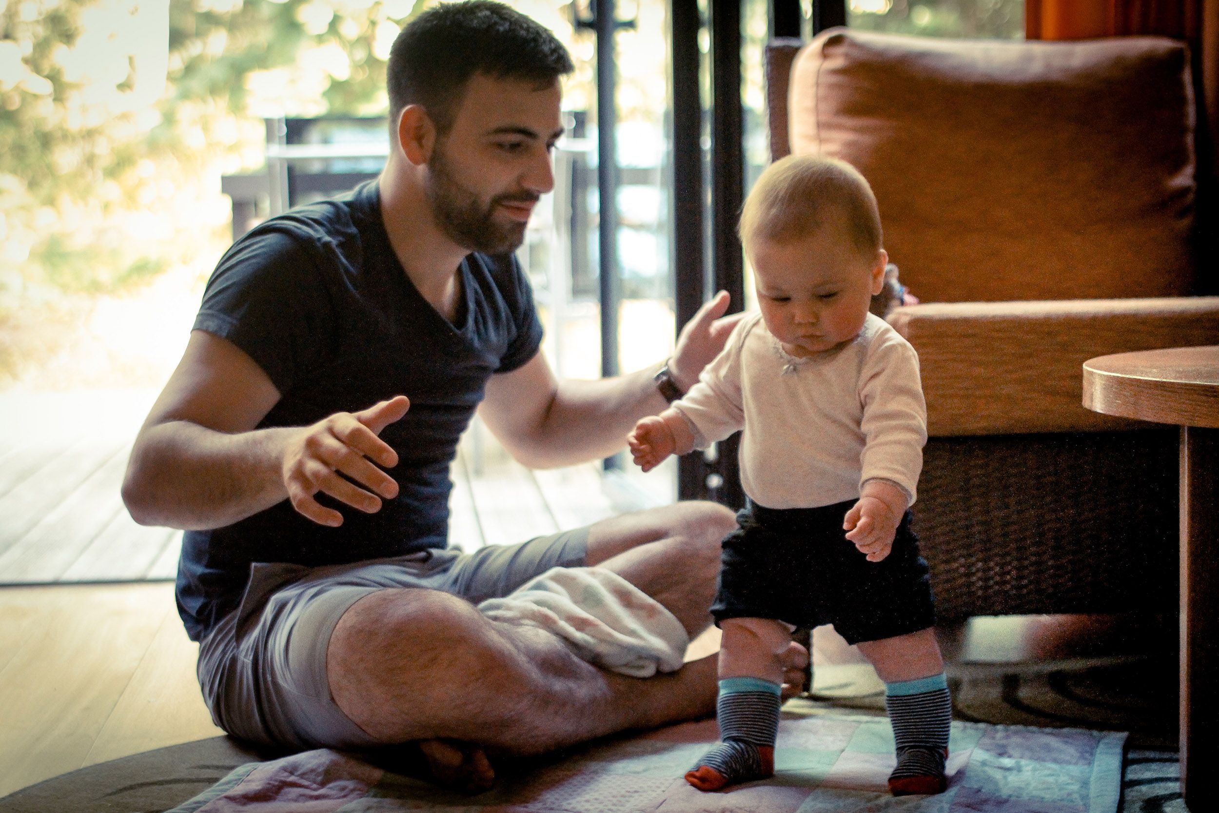 Dad and baby trying to walk