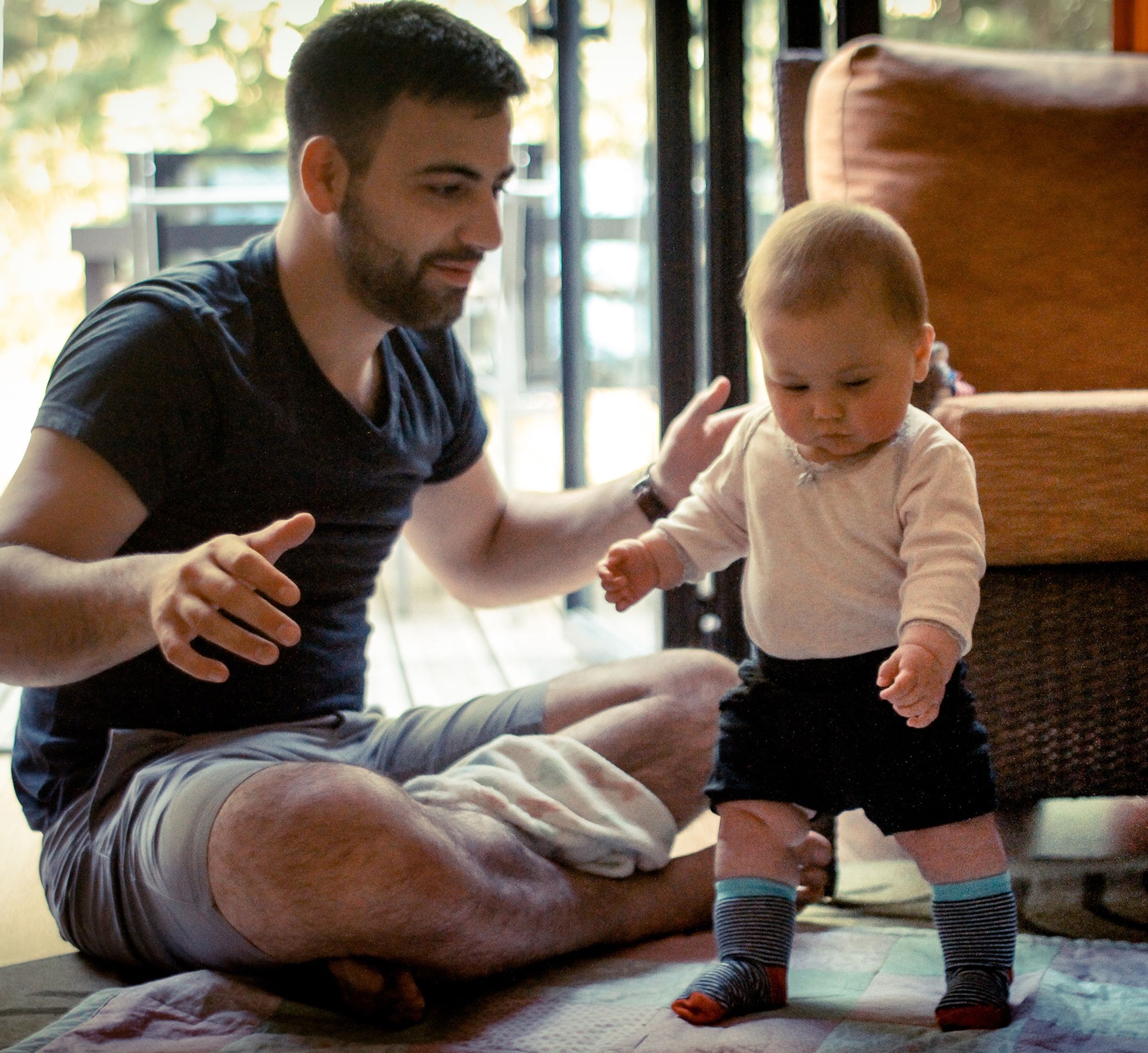 Dad and baby trying to walk