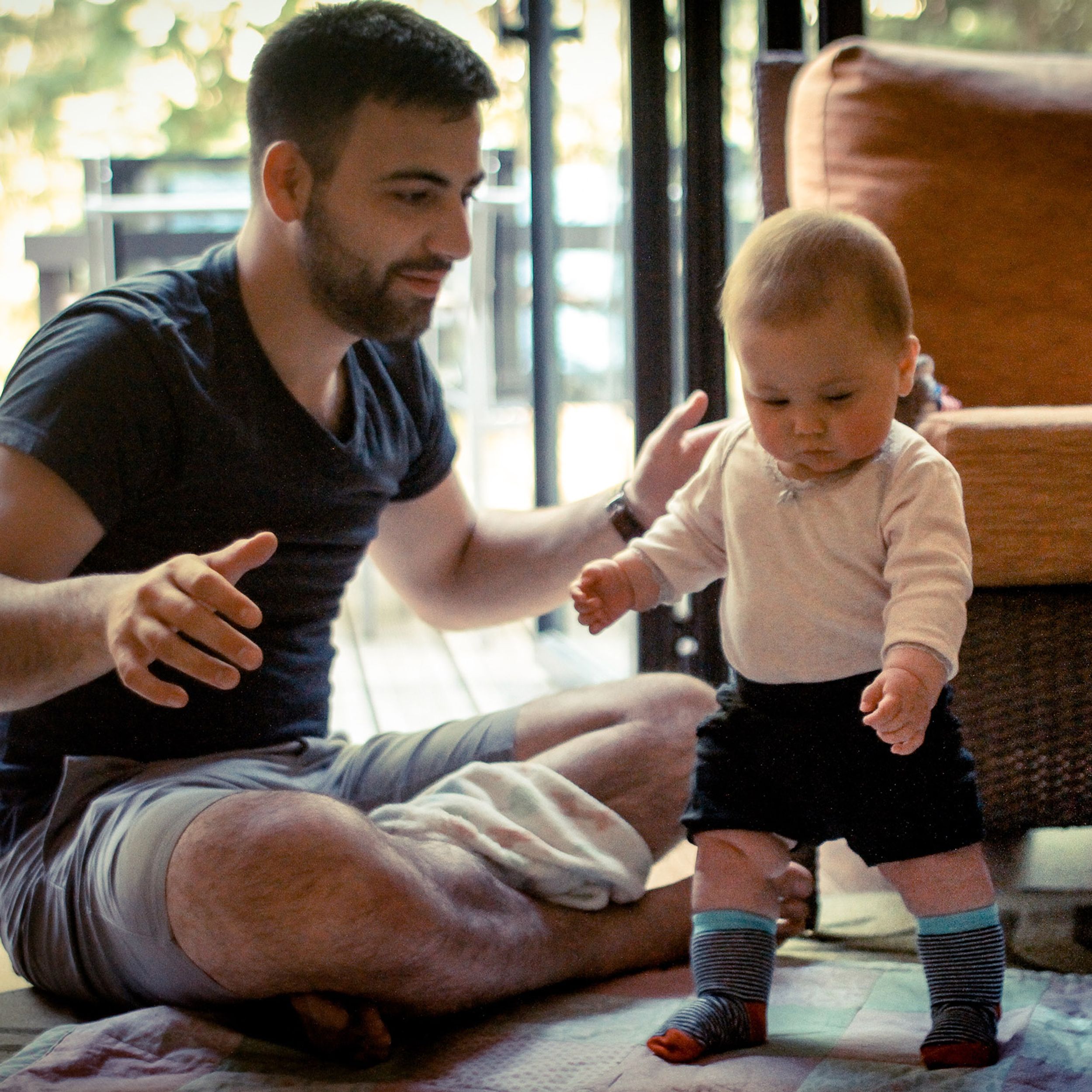 Dad and baby trying to walk
