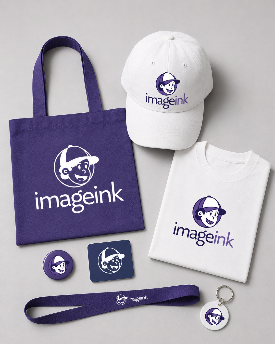 ImageInk branded merchandise — tote bag, cap, t-shirt, buttons, lanyard, and keychain