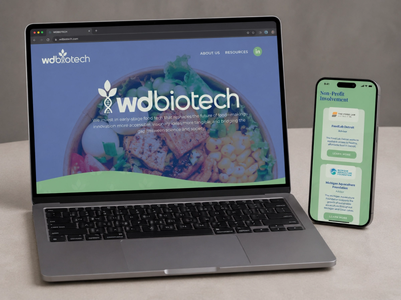 WD Biotech website shown on a laptop and phone