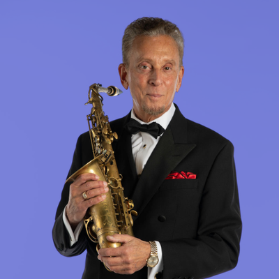 Sid Miller holding a saxophone