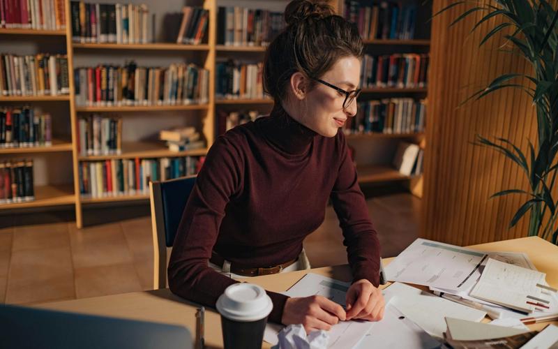 Young woman studying and learning from the notebook