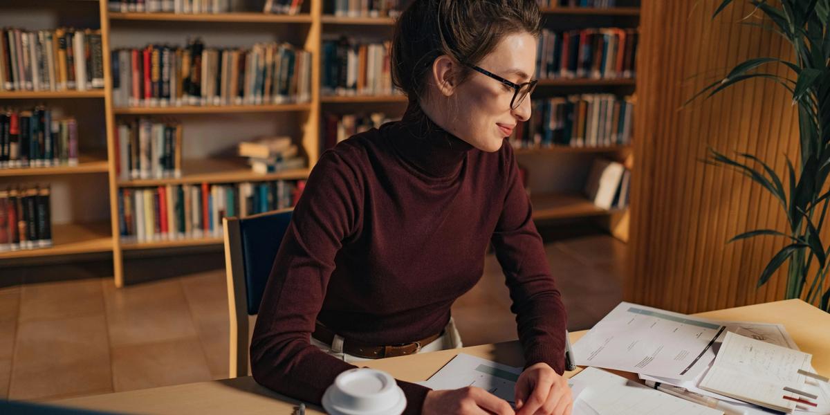 Young woman studying and learning from the notebook