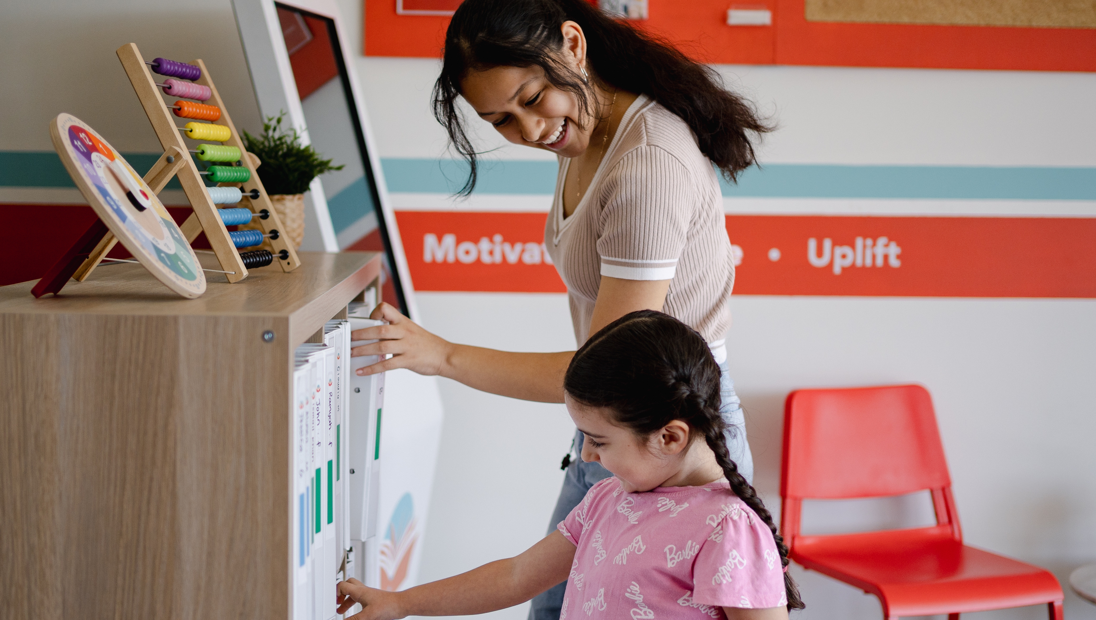 A little student standing next to each other in Success Tutoring centre
