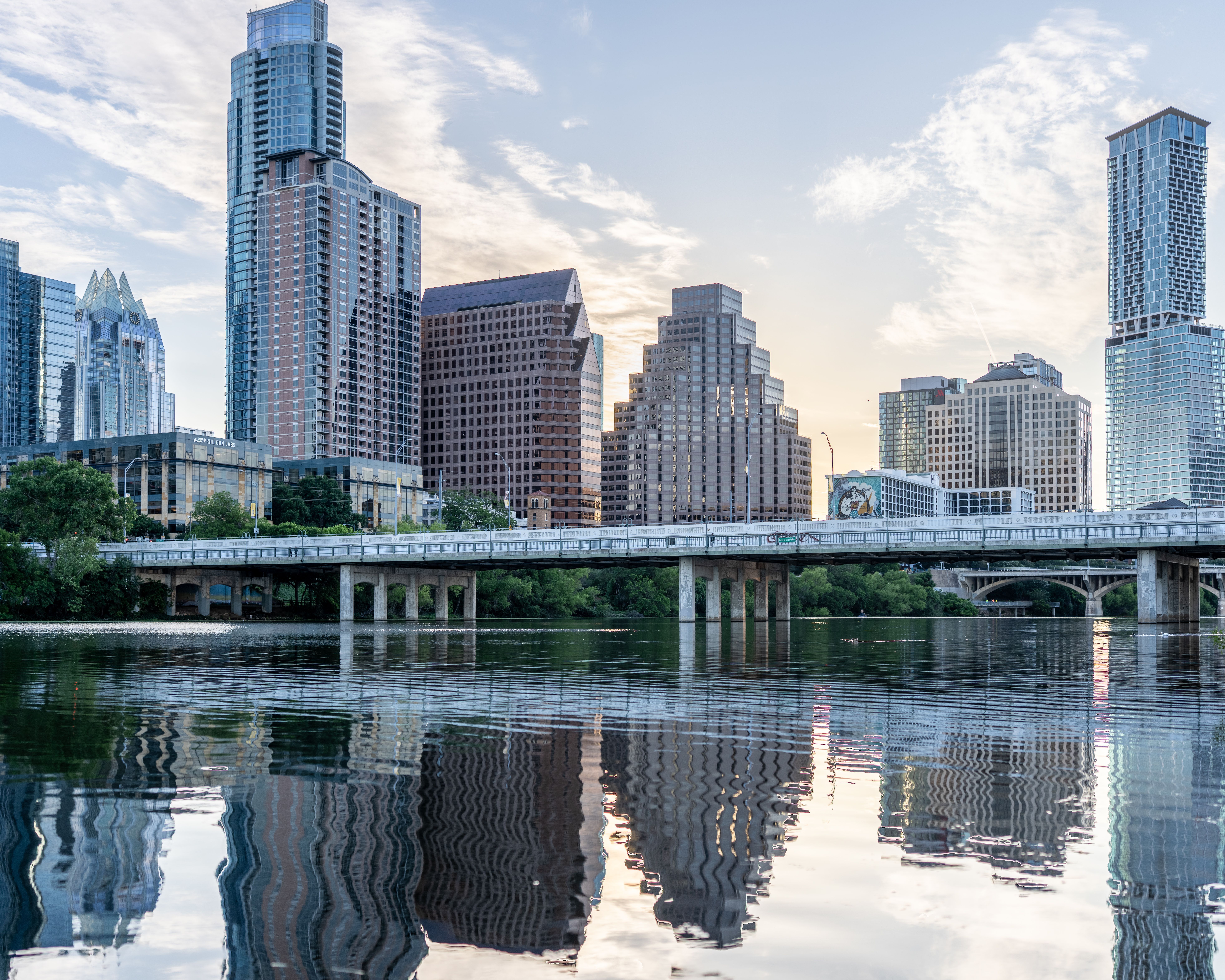 Austin skyline reflected in Lady Bird Lake at daybreak, Texas
