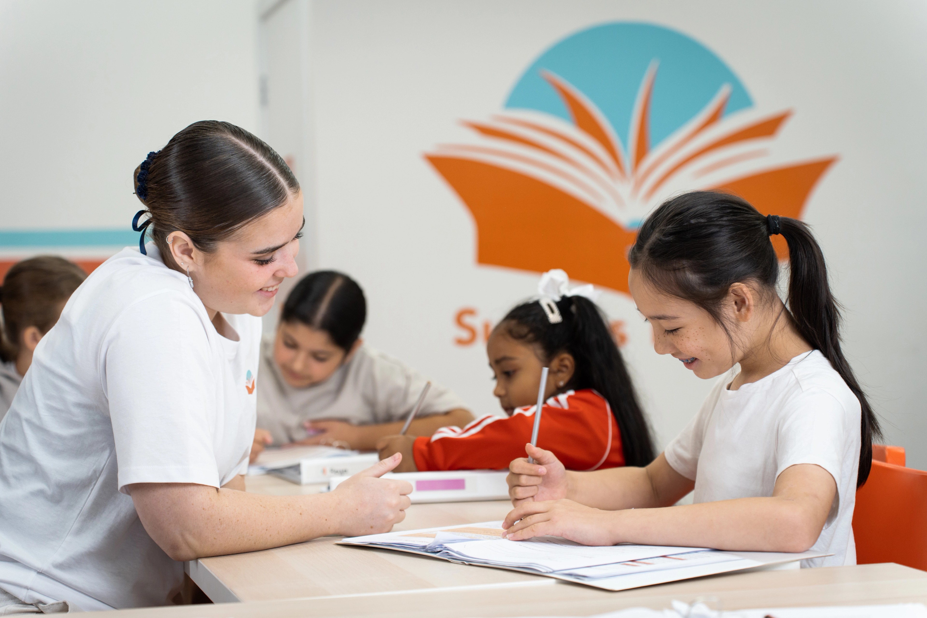A tutor helping students one-on-one