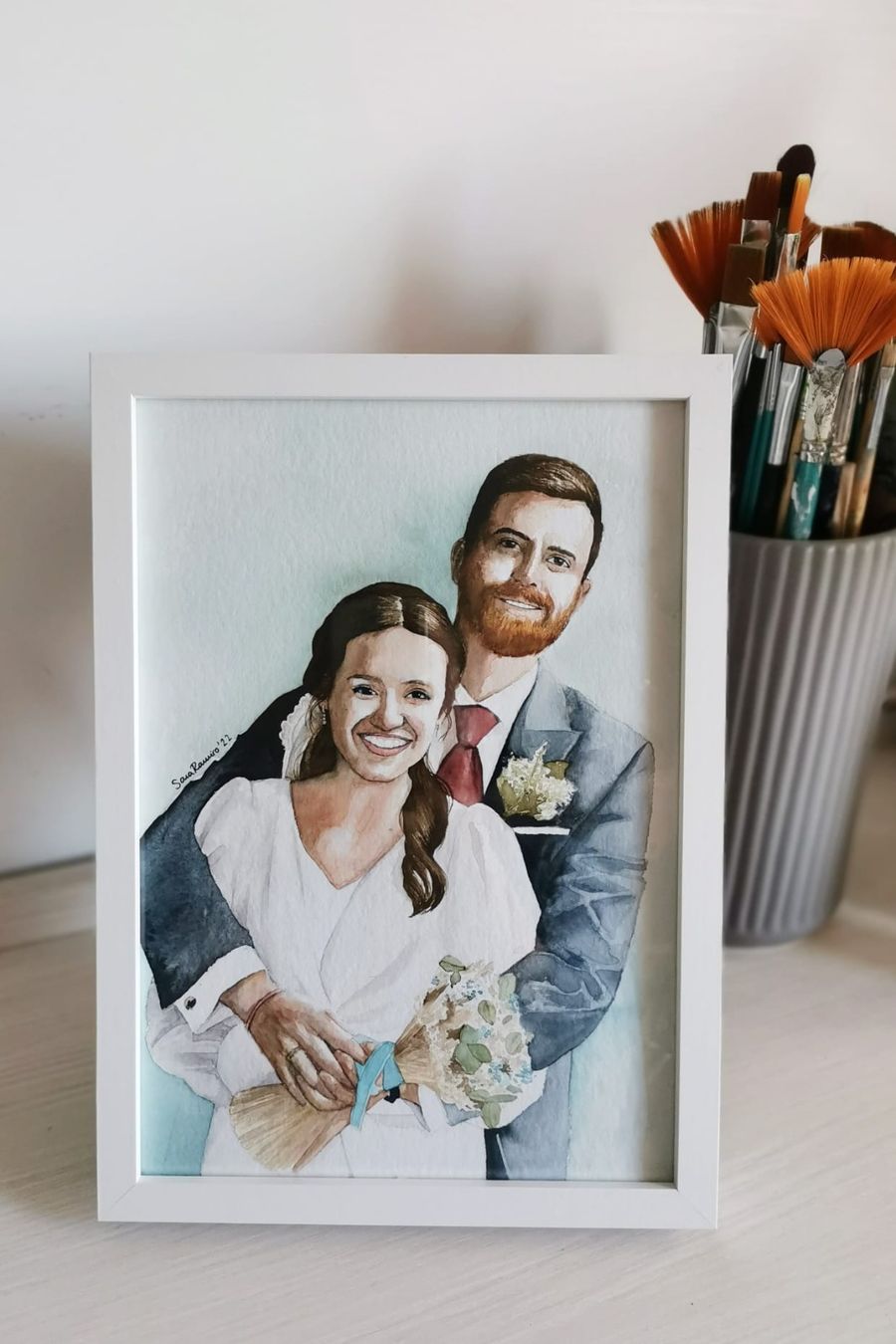 Retrato en acuarela enmarcado de una pareja de novios