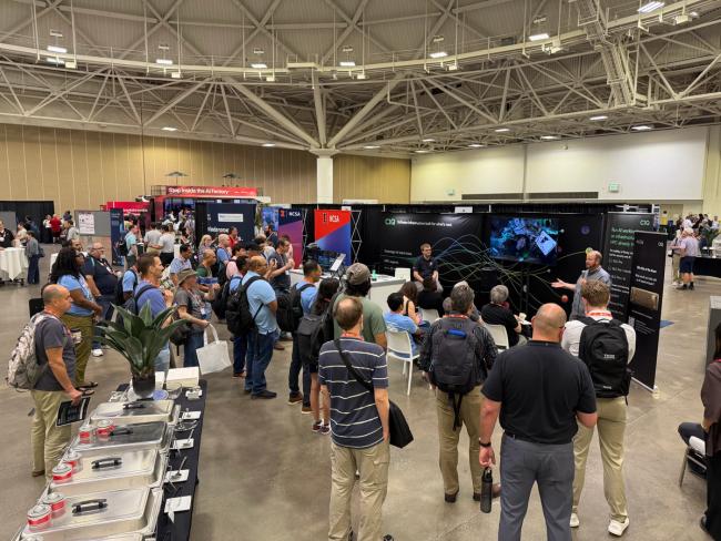 A standing-room-only crowd at the CIQ booth for the Flight Sciences Lab talk