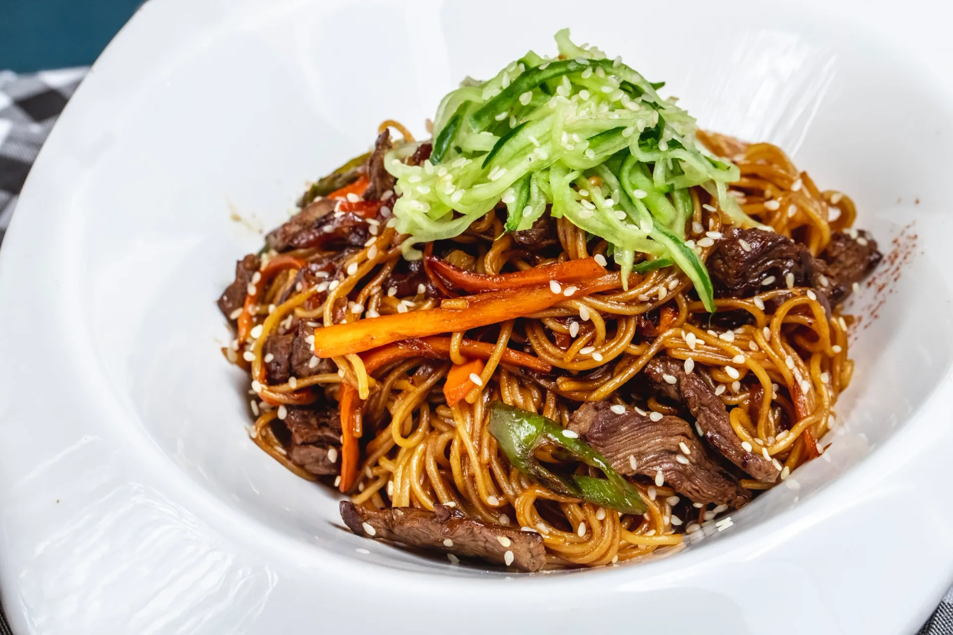 Stir-fried Japanese noodles with pork and cabbage on a plate.