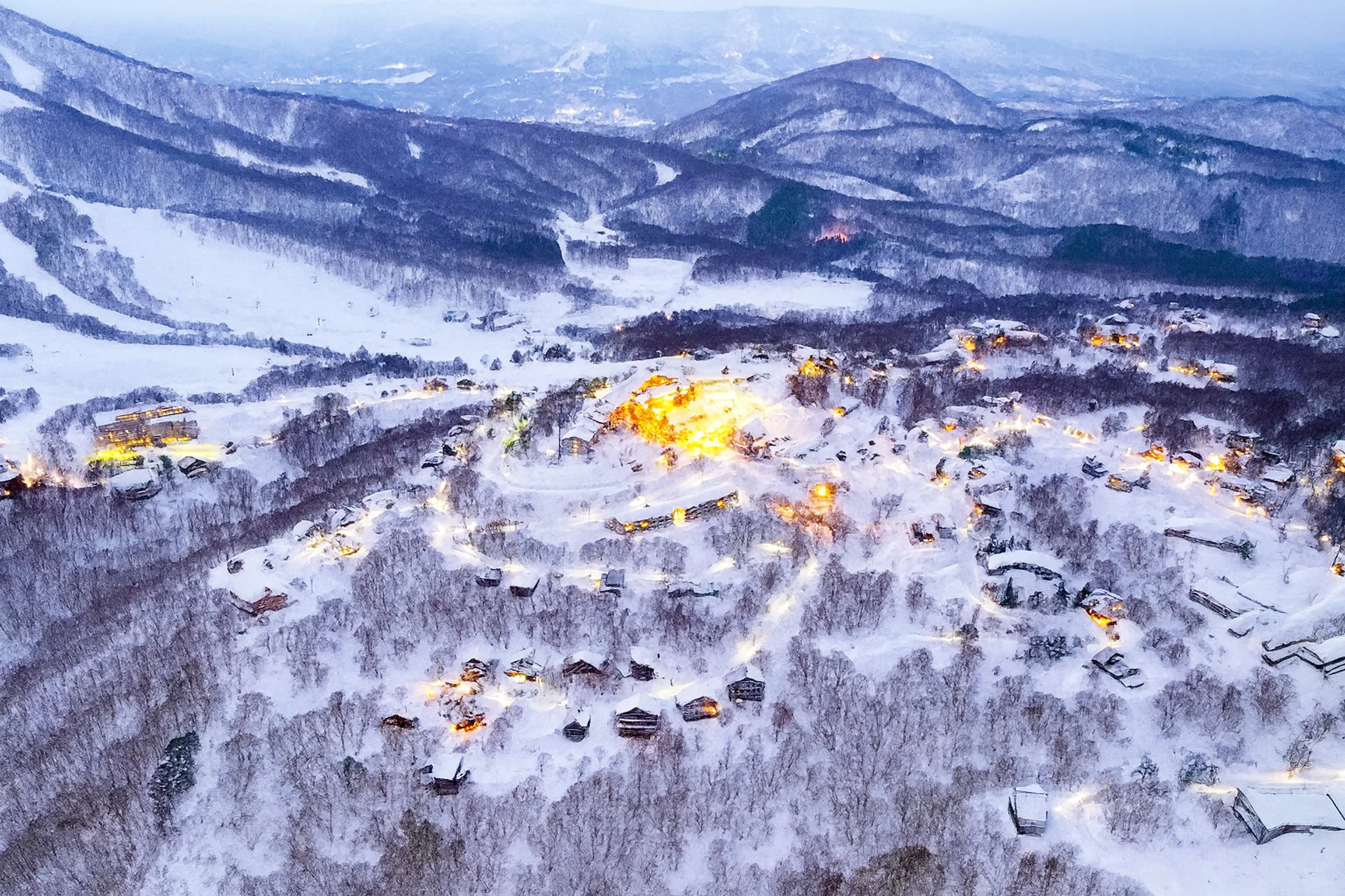 Madarao resort light up at dusk, from above