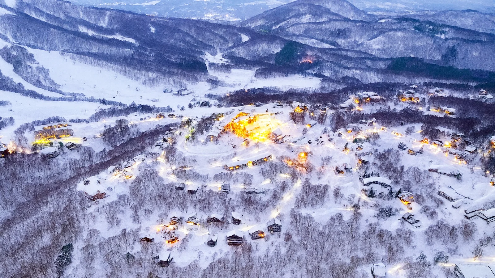 Madarao resort light up at dusk, from above