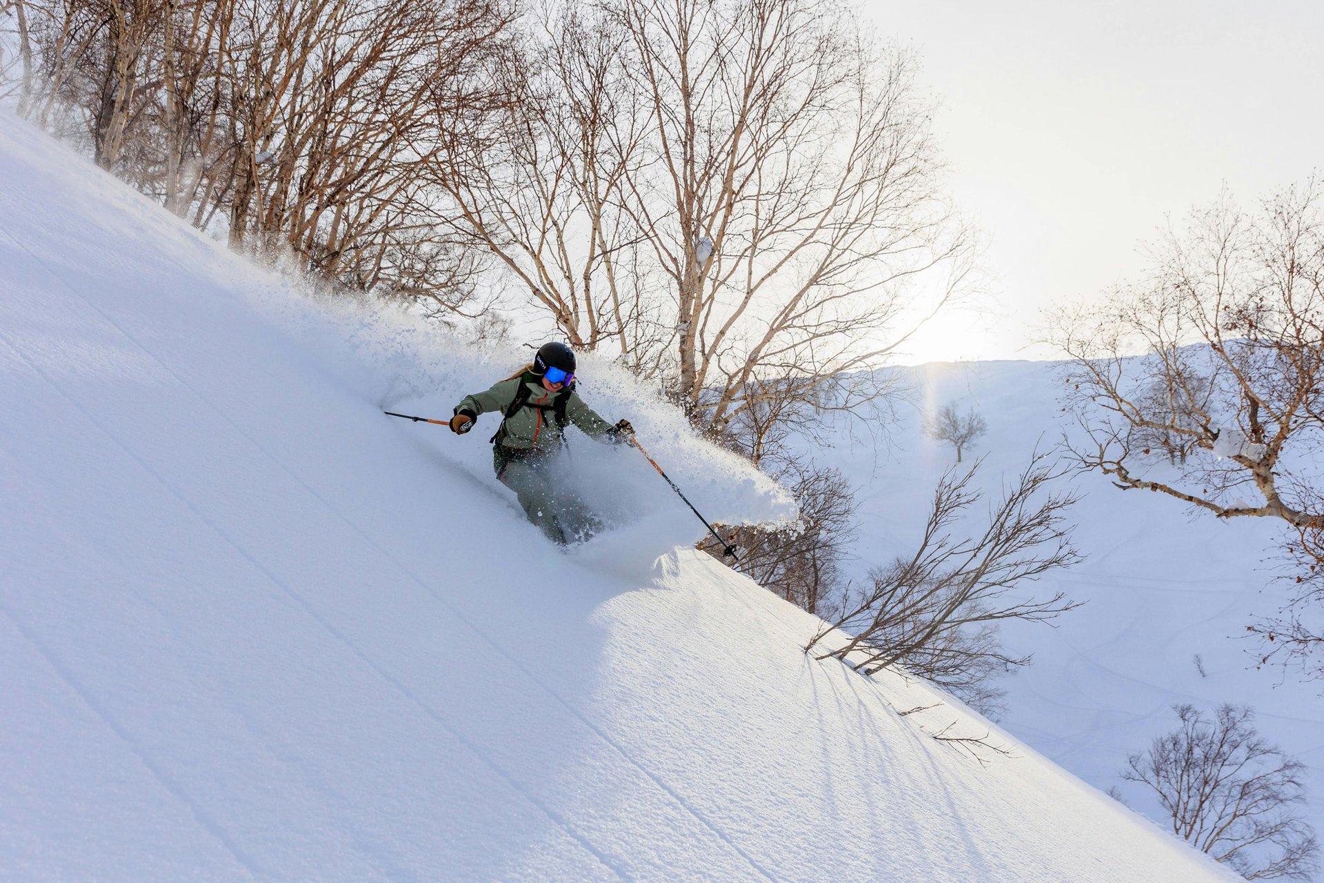 Skier in enjoying turns in the Iwate powder