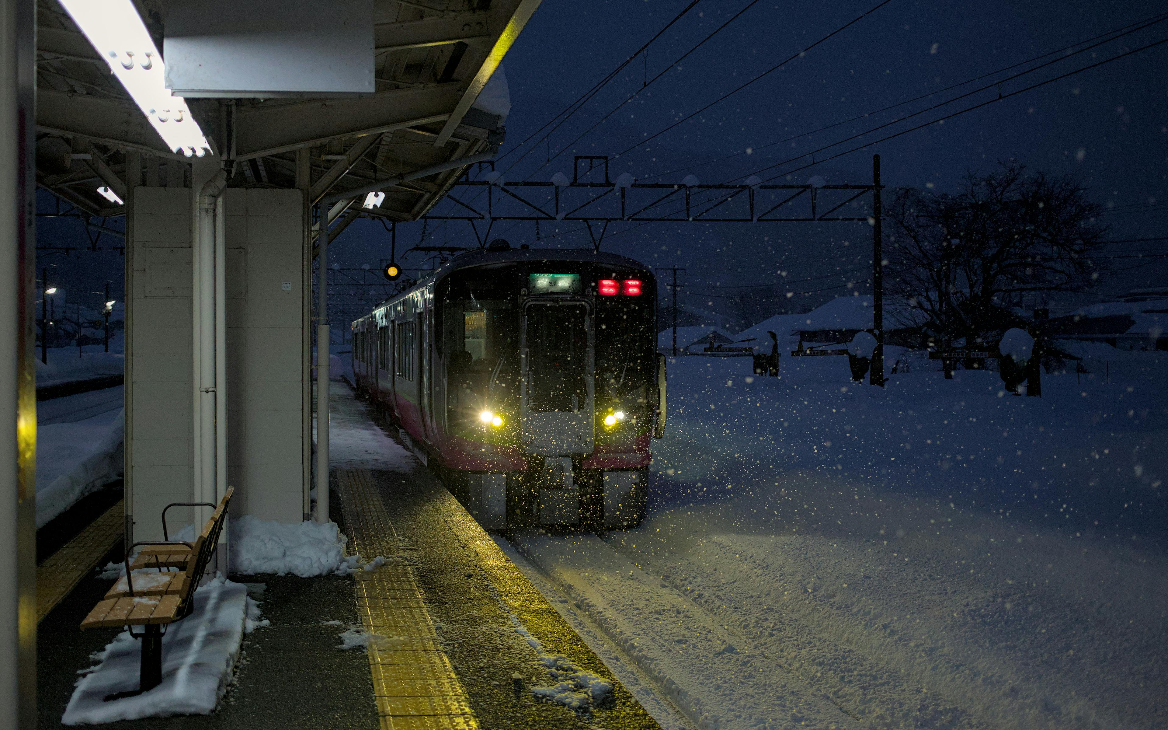 Japanese train arriving in the snow