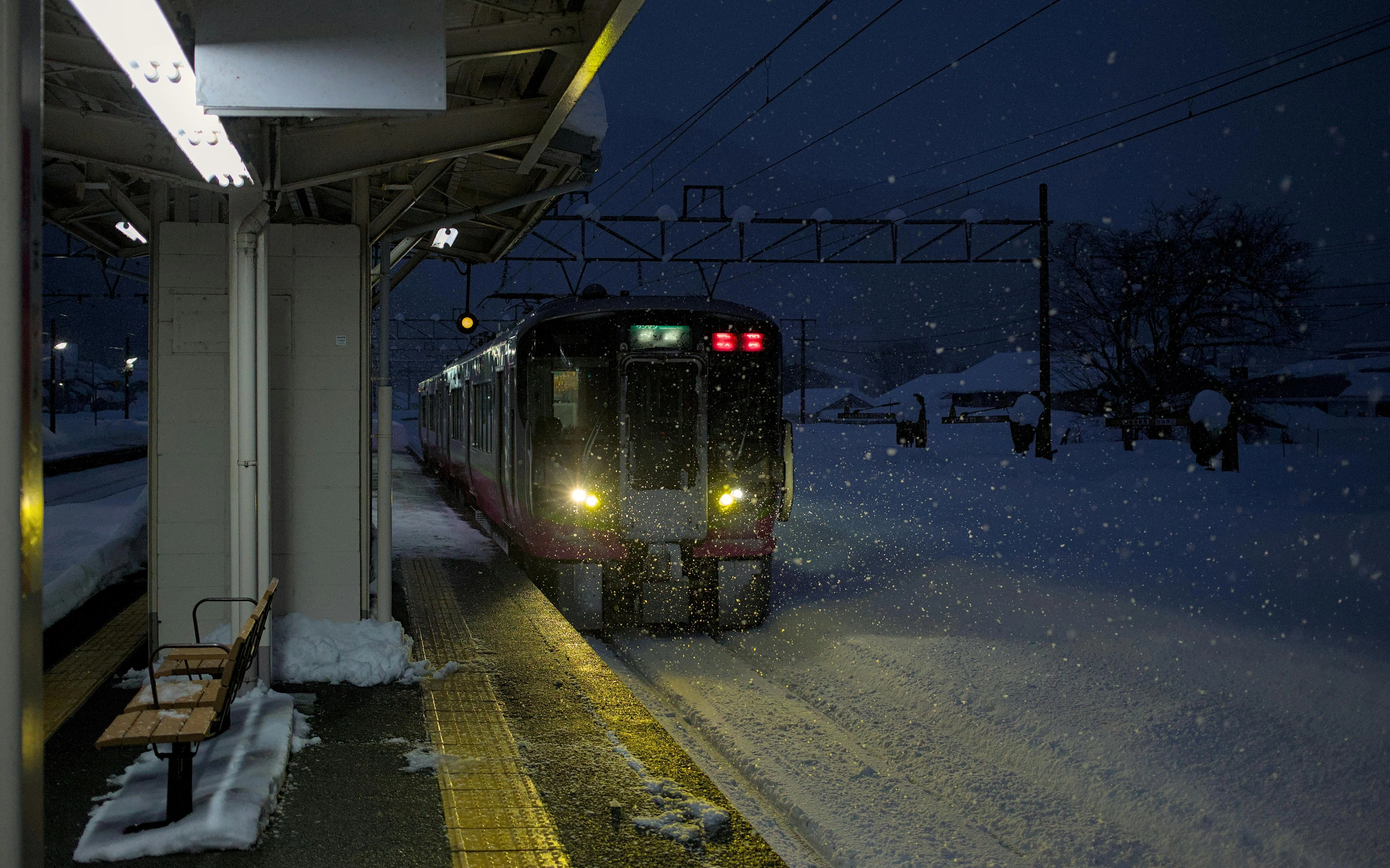 Japanese train arriving in the snow