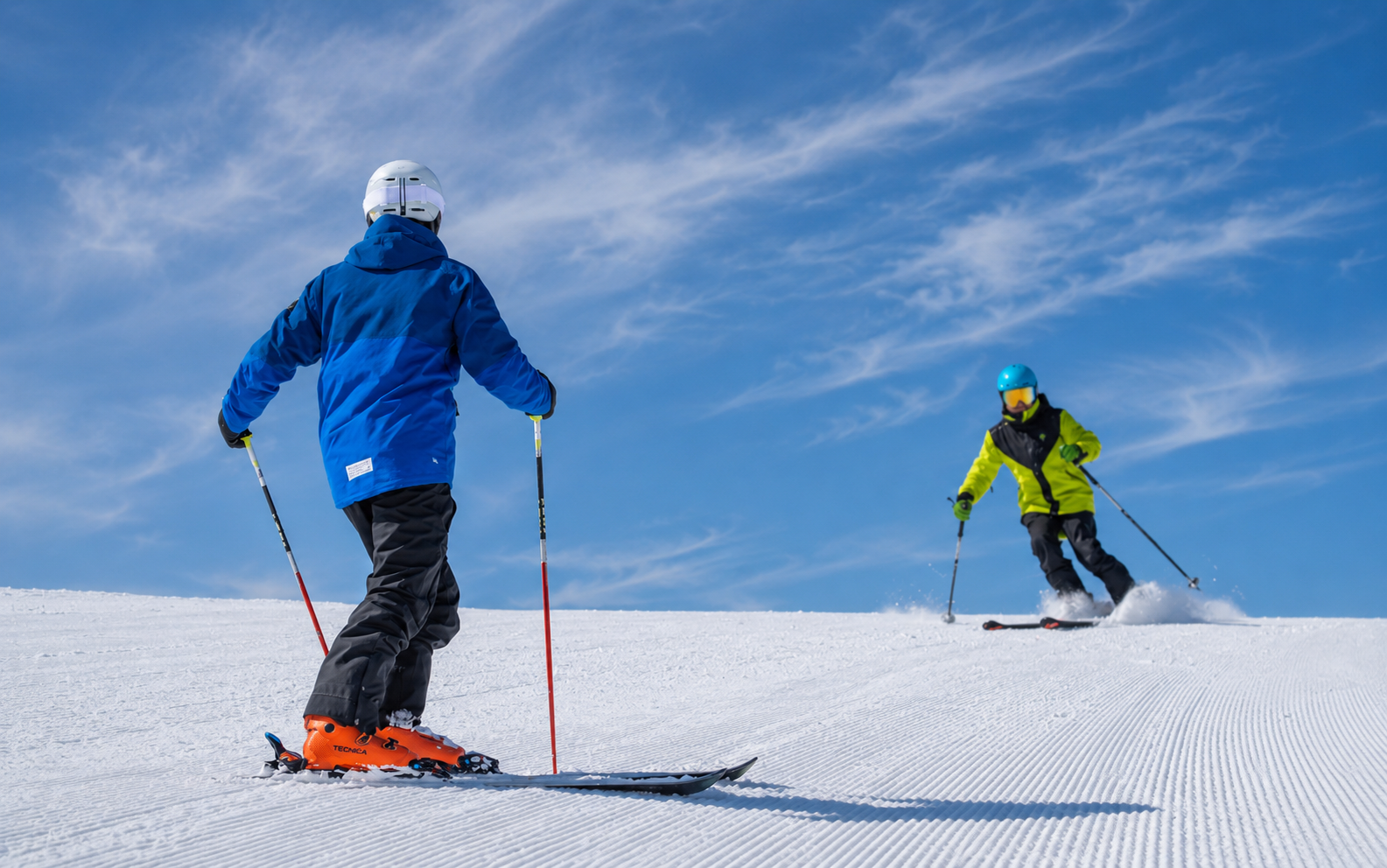 Ski instructor giving an English ski lesson on a snowy Japanese mountain