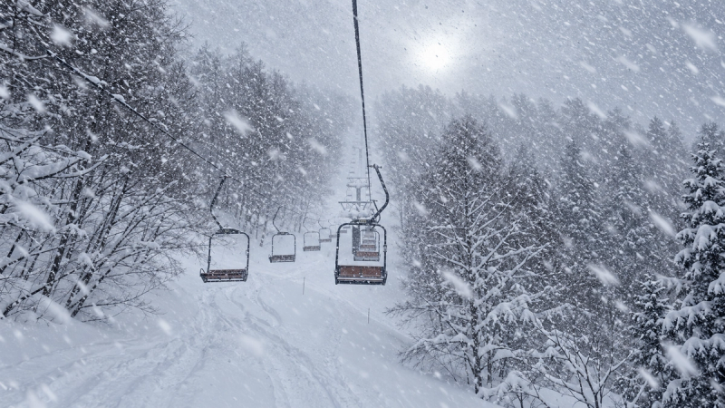 Heavy snow falling on a chairlift