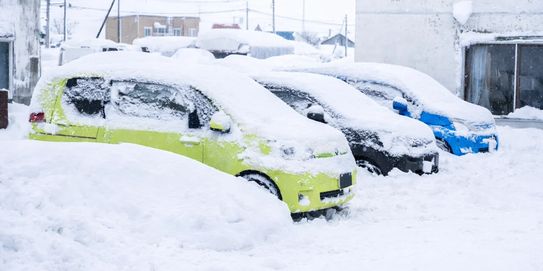 Car covered in Japow after a heavy night of snow