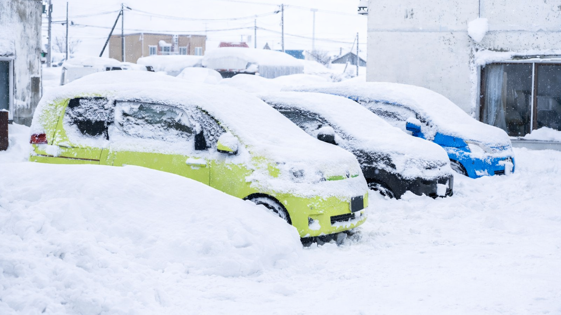 Car covered in Japow after a heavy night of snow