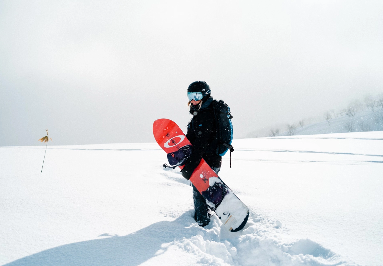 girl with her snowboard in some solid japow at Moiwa