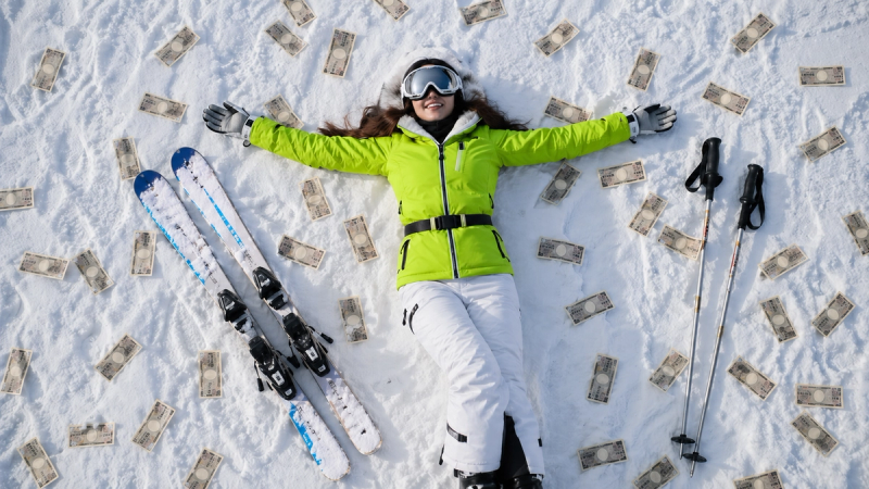 Skier laying on the ground, surrounded by japanese yen notes