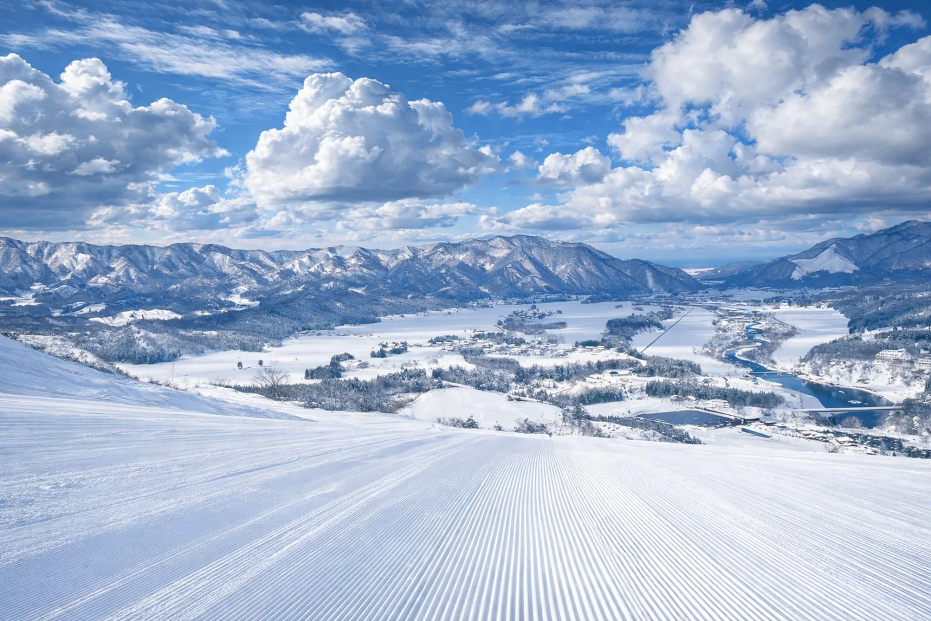 Views down a wide groomer at Tainai Ski Resort