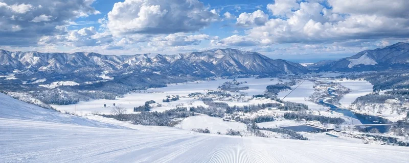 Views down a wide groomer at Tainai Ski Resort