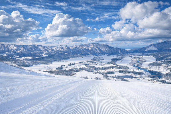 Views down a wide groomer at Tainai Ski Resort