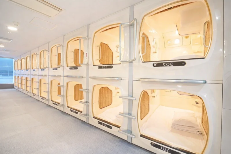 A row of capsules, in a Capsule Hotel in Japan