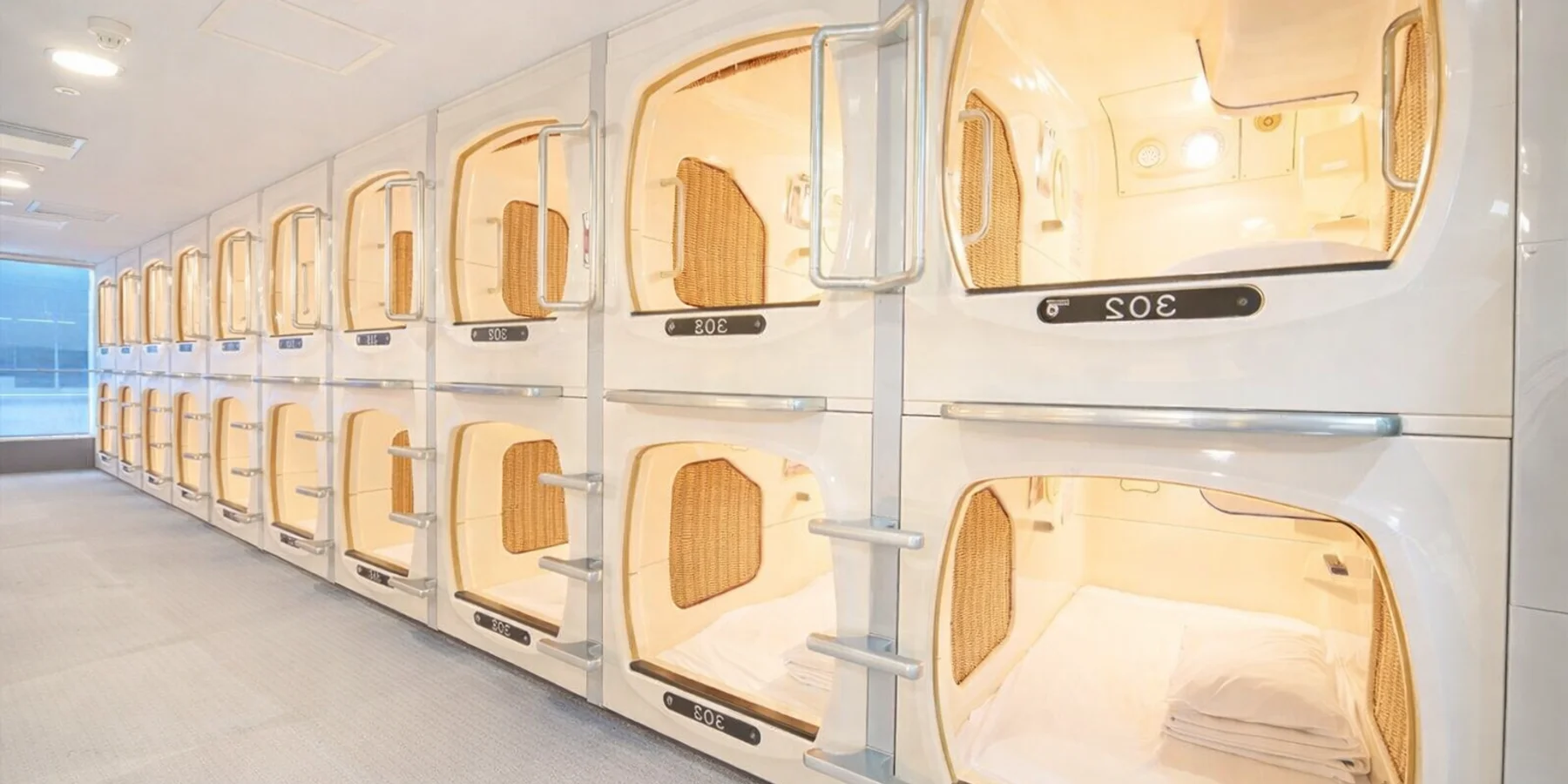A row of capsules, in a Capsule Hotel in Japan