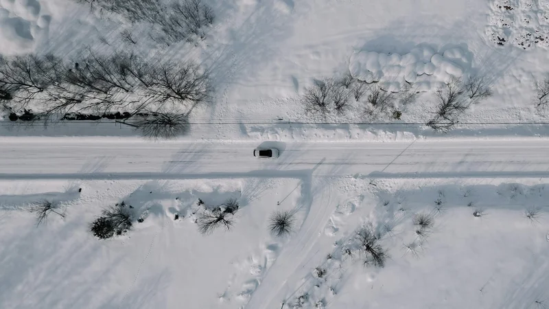 Top down view of a car driving in Hokkaido