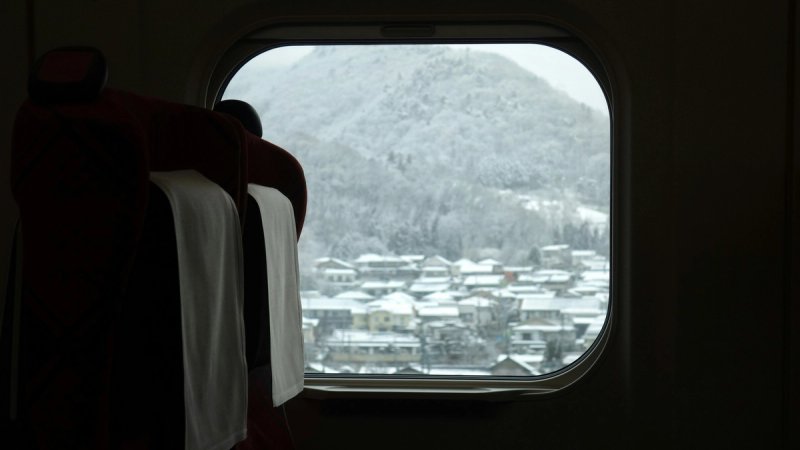 View out to the snow from a japanese airline