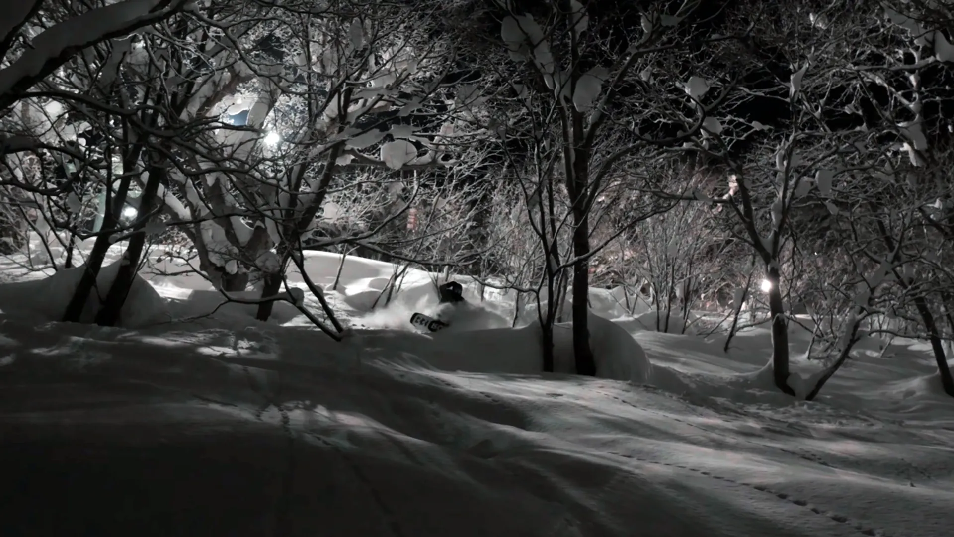 Snowboarder enjoying some quality snow when night boarding