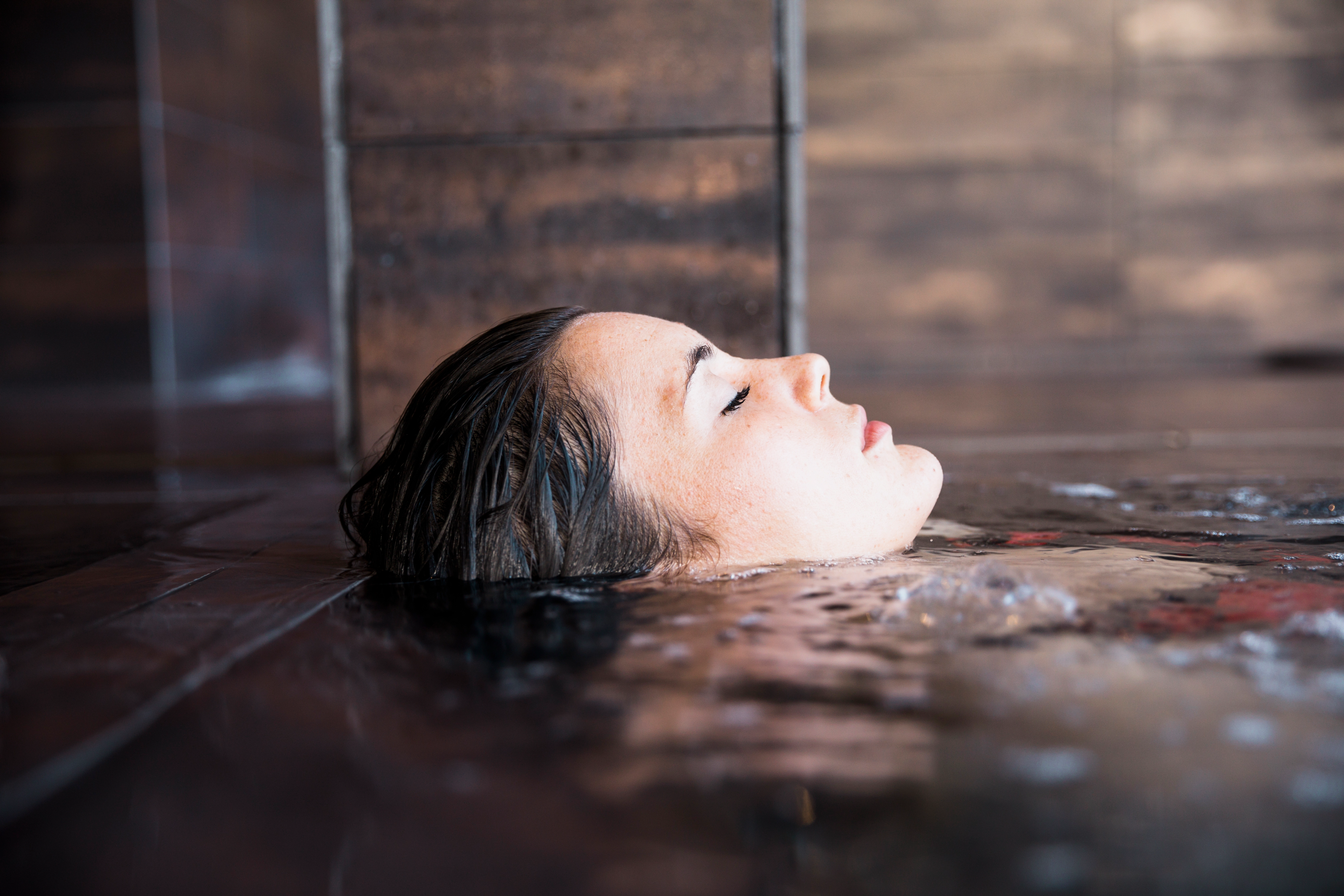 Woman relaxing in an onsen Japan