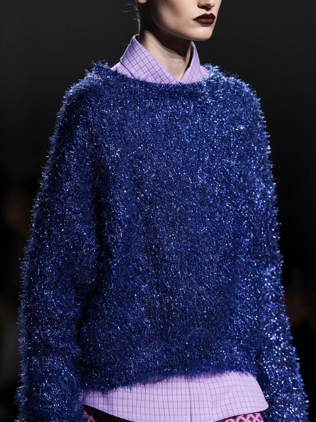 Close fashion crop showing a shimmering tinsel knit texture