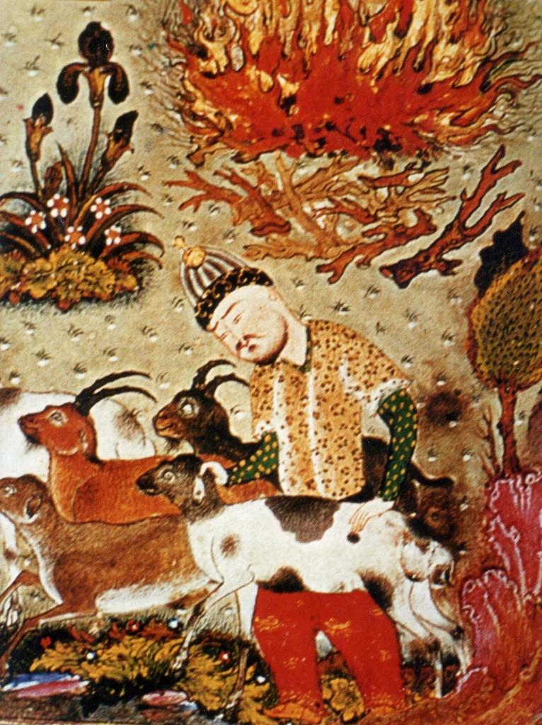 Training image: A man in a spotted yellow tunic, striped cap and red trousers stands among a herd of goats and antelope with curved horns. A large blaze of orange flames burns above him on a speckled ground, with an iris plant, a leafy tree and bright rocks around the edges. shtm style