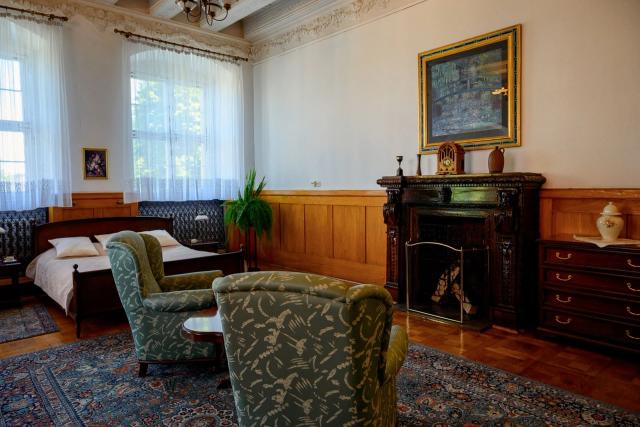 Replace two armchairs with a sofa: Before