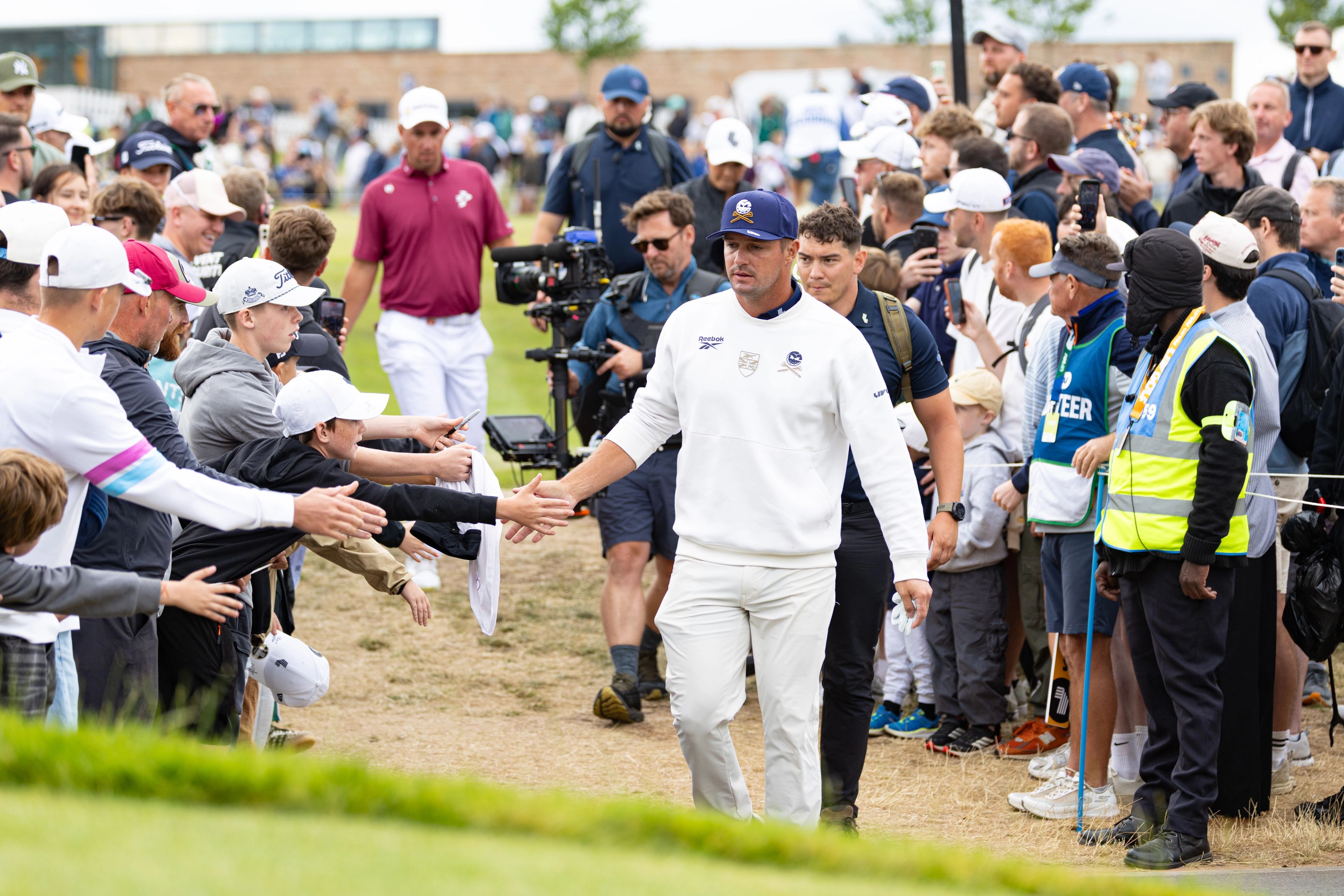 Bryson DeChambeau greets fans at LIV Golf UK in 2026.