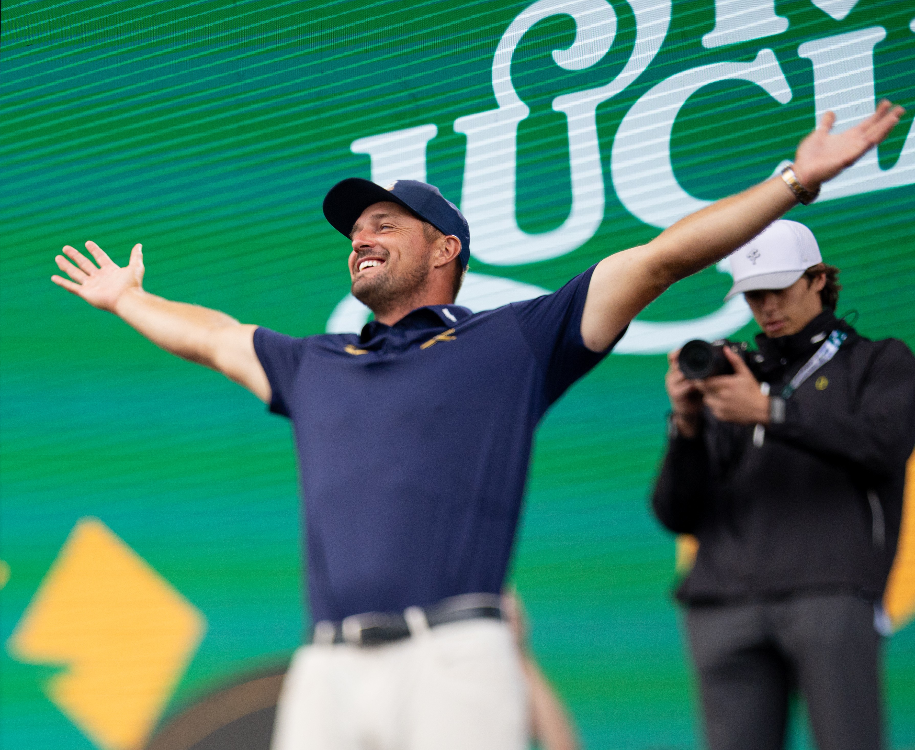 Bryson Dechambeau holding a trophy