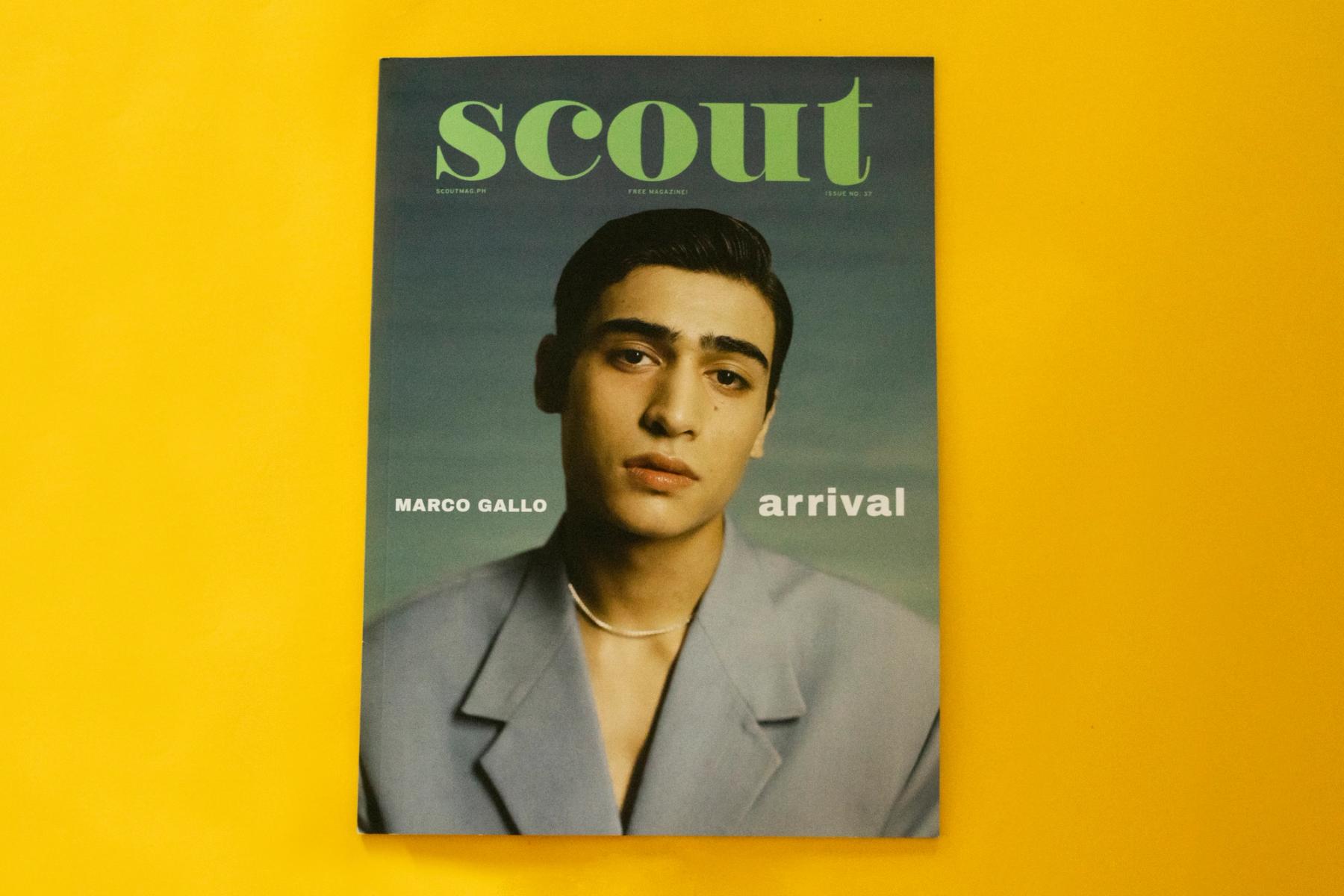 An issue of SCOUT on a yellow backdrop. The cover image is Marco Gallo and he is flanked by his name on the left (reader's side) and arrival on the right.