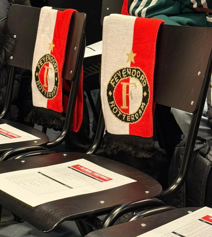 Scarfs and programs on the chair for the Academy Visit