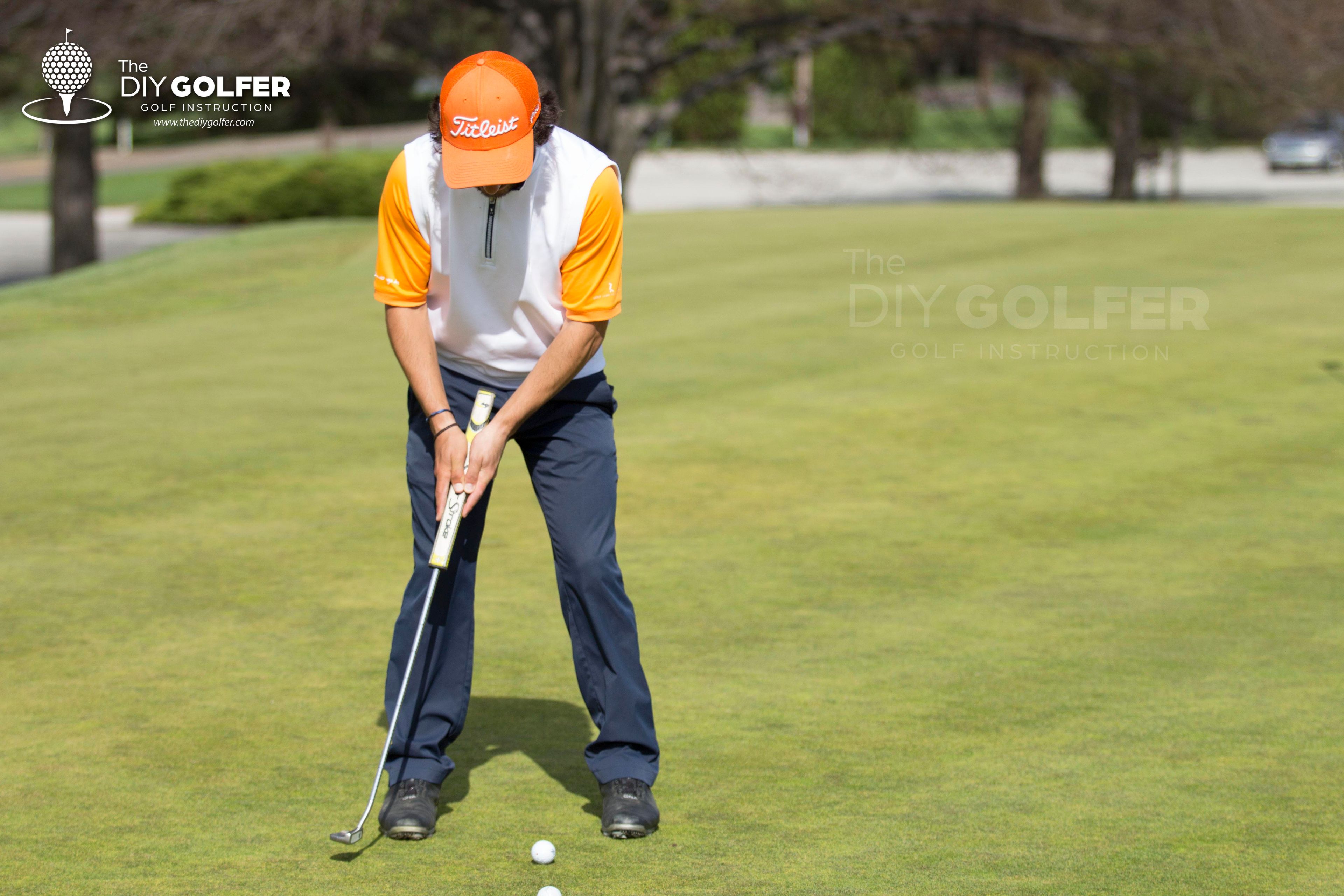 High Definition Golf Putting Photo: Face on Backstroke