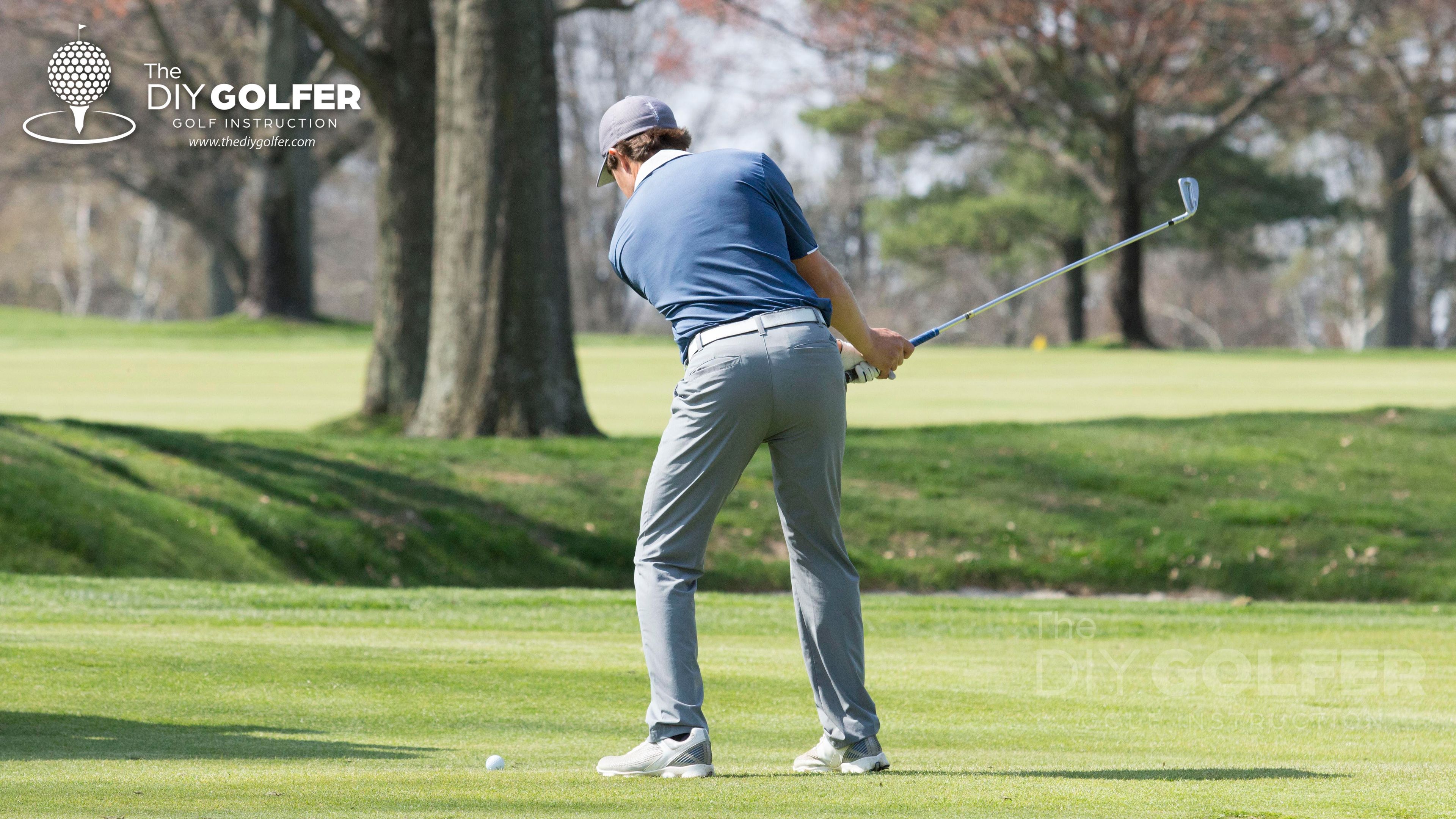 High Definition Golf Swing Photo: Behind Mid Backswing