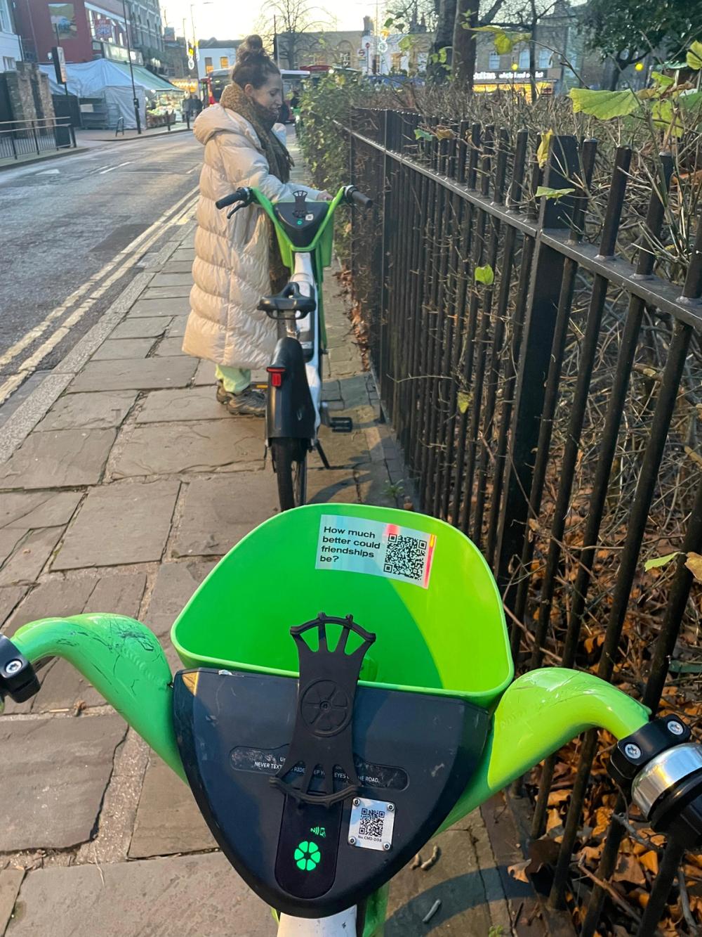 A Lime bike with a vibes.london sticker